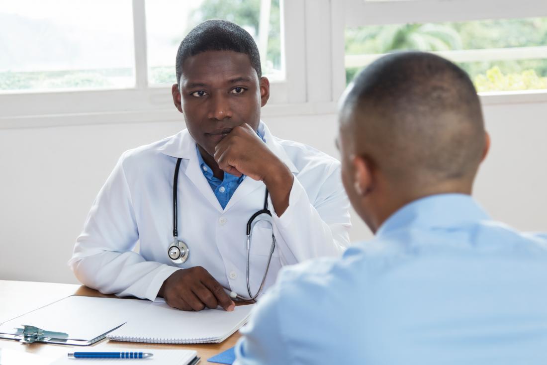 Doctor speaking with his patient