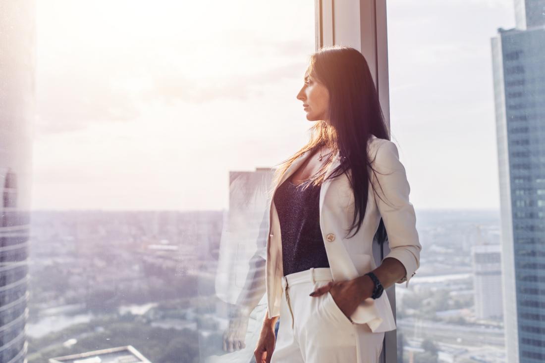 woman looking out the window