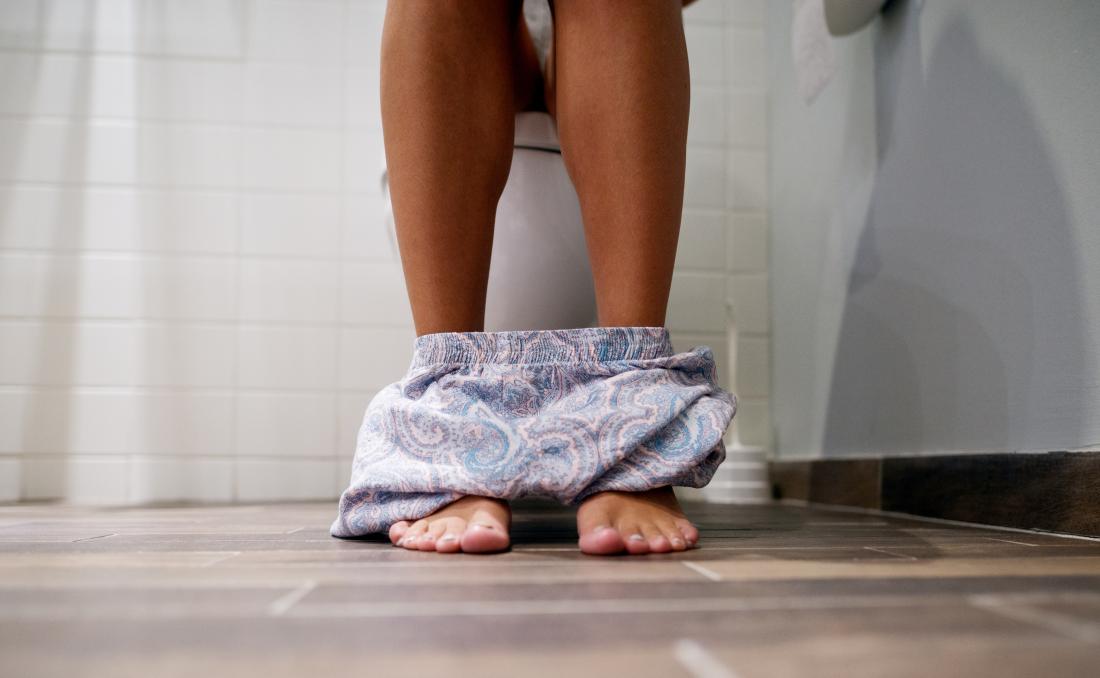 Woman using the toilet