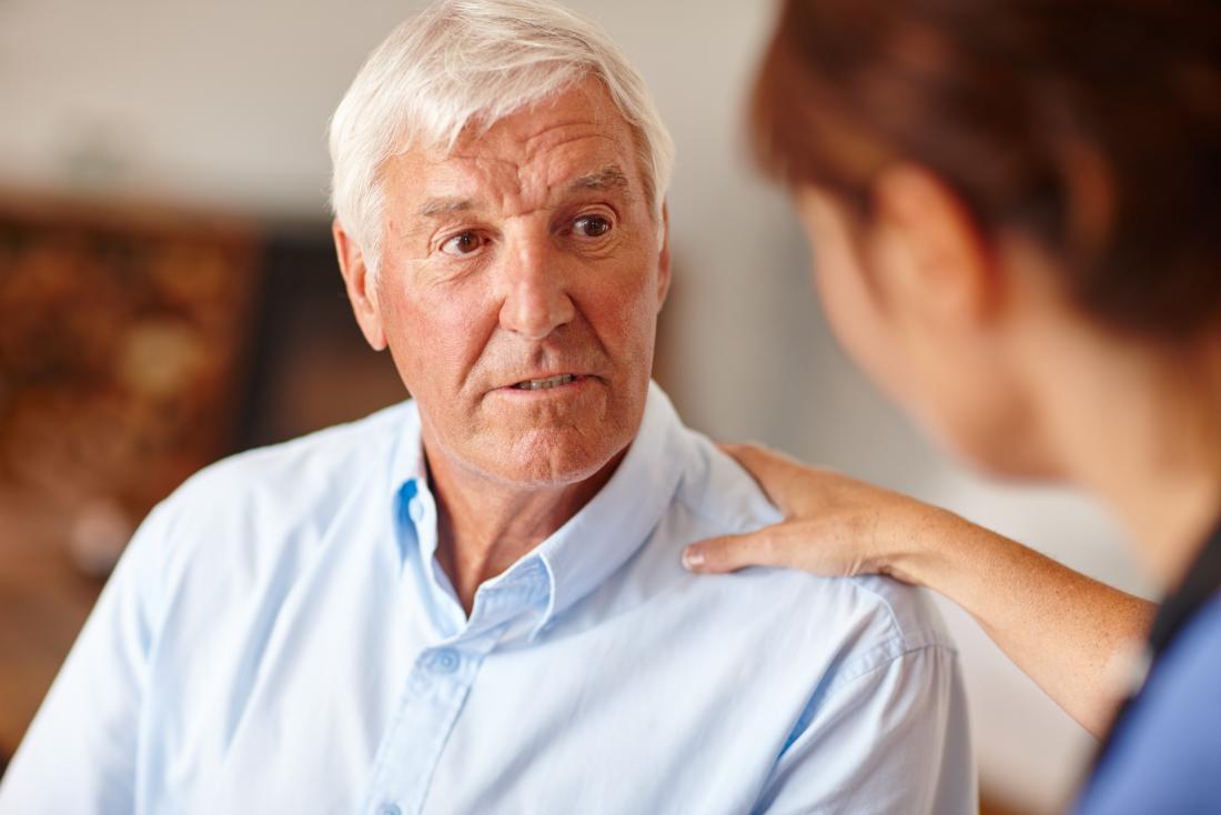 senior man speaking to doctor