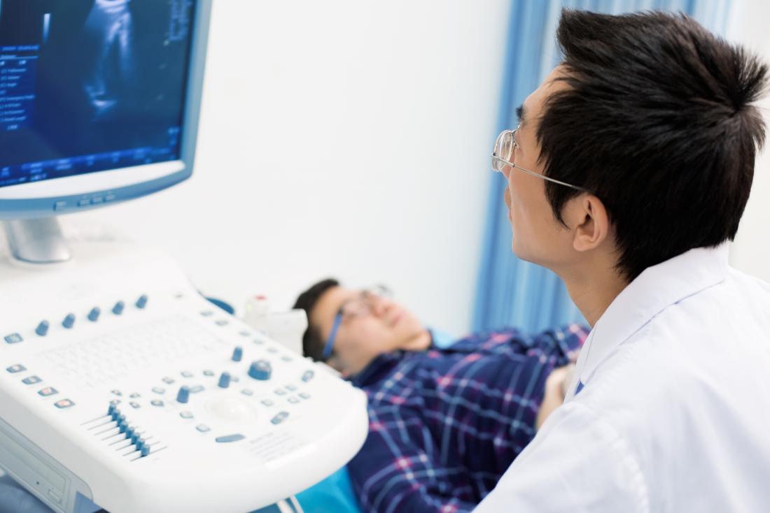 man having ultrasound scan performed