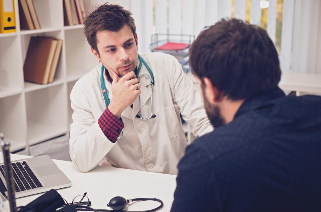 Doctor speaking with his patient who is concerned about micropenis